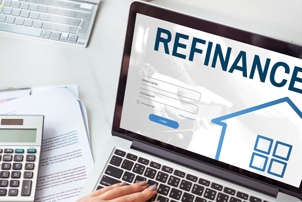 Laptop showing a generic refinance login page with a calculator and documents.